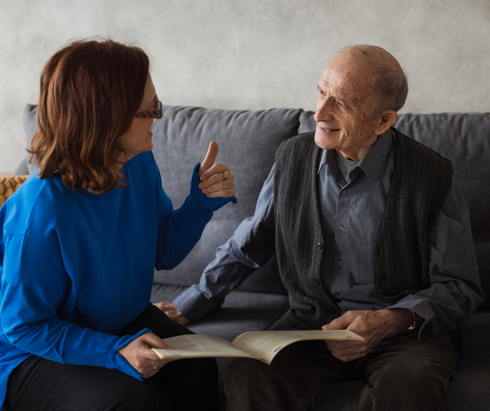 Elderly man and woman having a conversation.